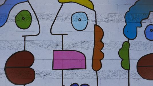 Playful Wall Faces — 64-piece jigsaw puzzle