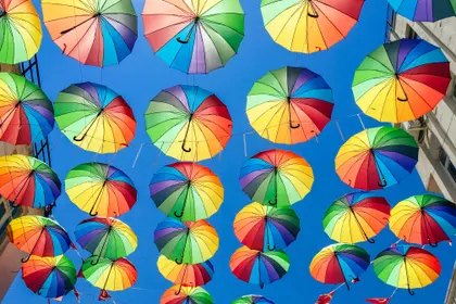 Rainbow Umbrellas Against Blue Sky — 294-piece jigsaw puzzle